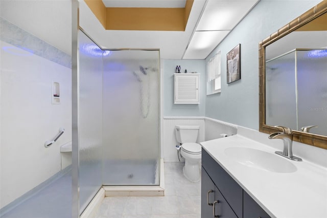 bathroom with tile patterned floors, vanity, toilet, and an enclosed shower