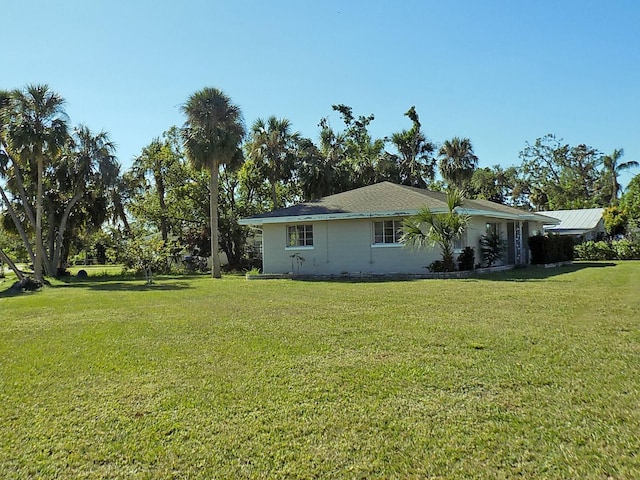 view of home's exterior with a lawn