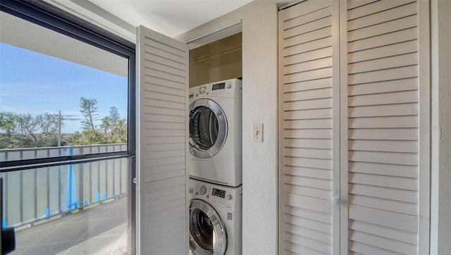 washroom with stacked washer and dryer