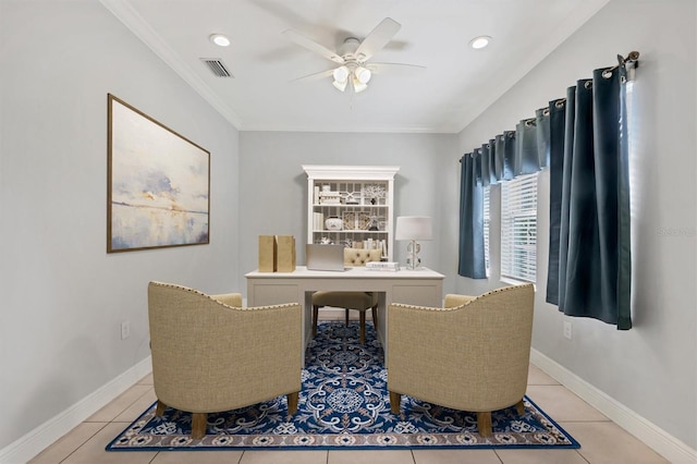 tiled dining area with ceiling fan and ornamental molding