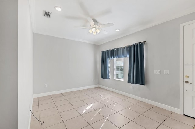 spare room featuring ceiling fan and light tile patterned floors