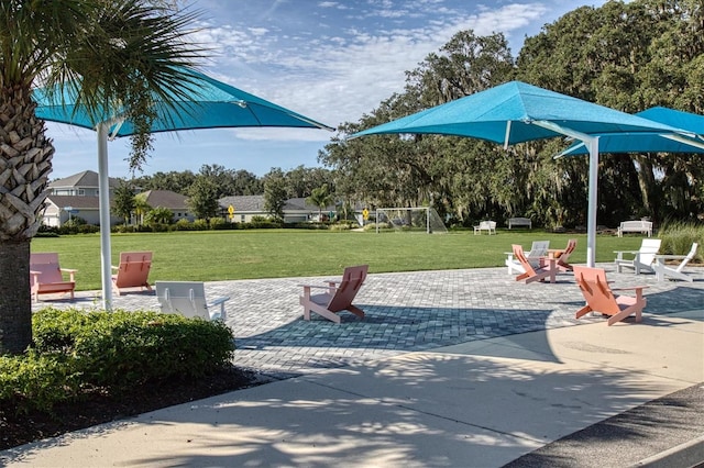 surrounding community featuring a patio