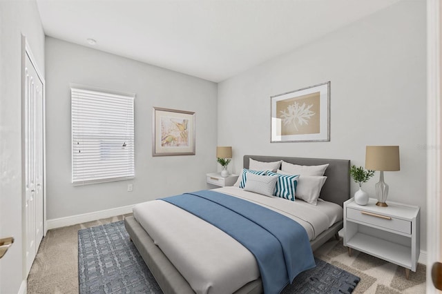 carpeted bedroom with a closet