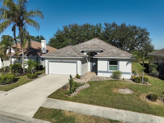 single story home with a garage and a front yard