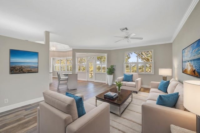 living room featuring french doors, hardwood / wood-style flooring, ceiling fan, and ornamental molding