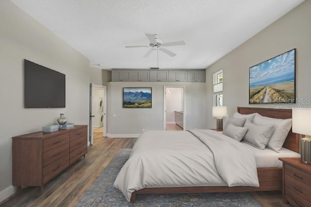 bedroom featuring ceiling fan, dark hardwood / wood-style flooring, and connected bathroom