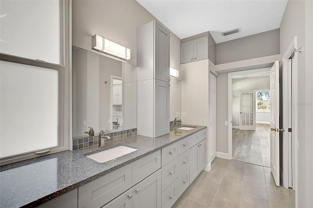 bathroom with tile patterned flooring and vanity