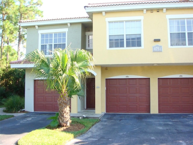 mediterranean / spanish house featuring a garage