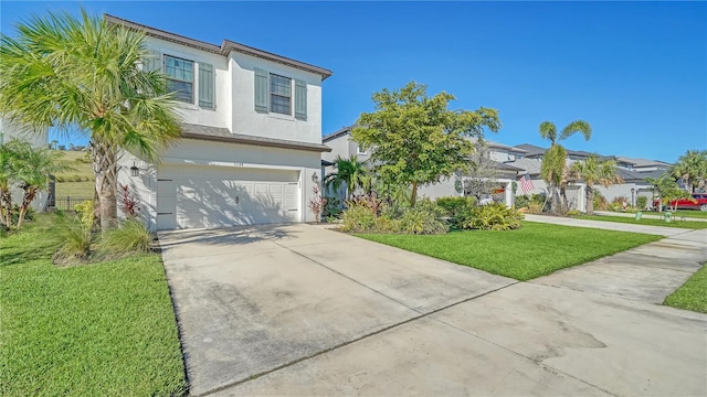 view of front of property with a front lawn and a garage