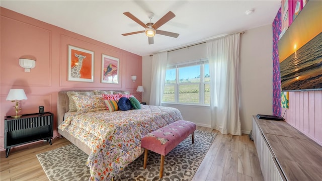 bedroom featuring ceiling fan and light hardwood / wood-style flooring