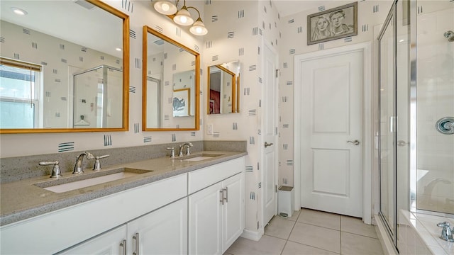 bathroom with tile patterned flooring, vanity, and a shower with shower door