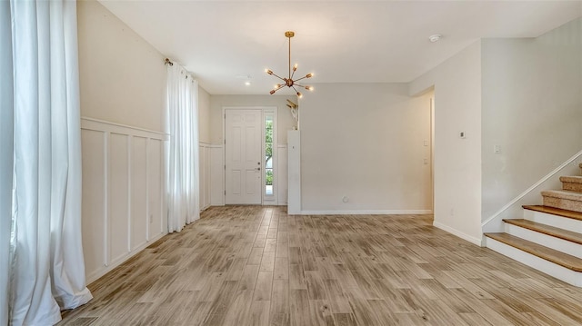 entryway featuring a notable chandelier and light wood-type flooring