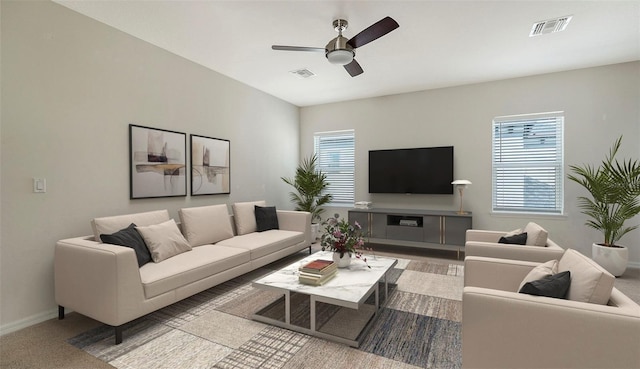 carpeted living room featuring ceiling fan