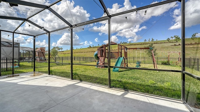 unfurnished sunroom featuring a rural view