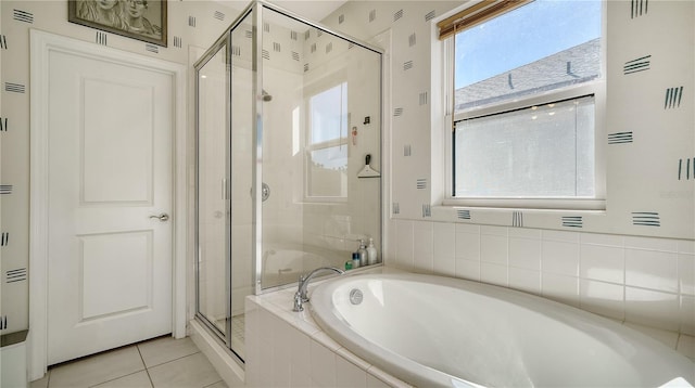 bathroom with independent shower and bath and tile patterned floors