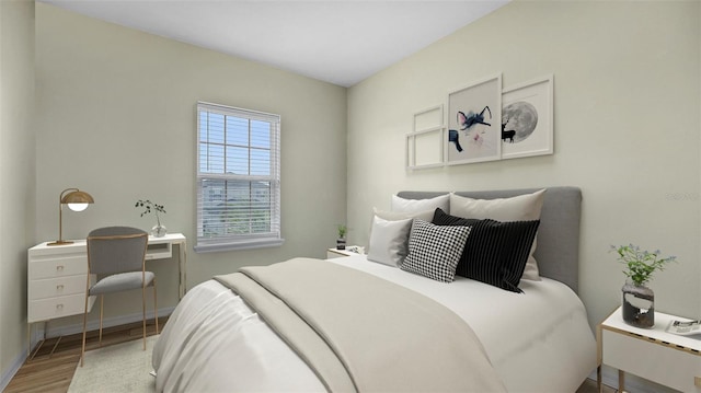 bedroom with hardwood / wood-style floors