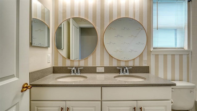 bathroom with vanity and toilet