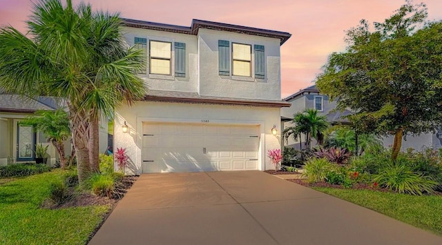 5548 Summit Gln, Bradenton, FL 34203 - view of front of property with an attached garage, stucco siding, and driveway