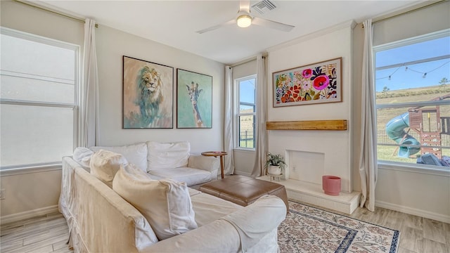 5548 Summit Gln, Bradenton, FL 34203 - living area featuring plenty of natural light, light wood-style floors, and ceiling fan