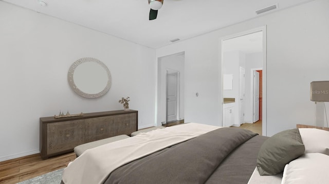 5548 Summit Gln, Bradenton, FL 34203 - bedroom featuring light wood-style floors, ceiling fan, and ensuite bath