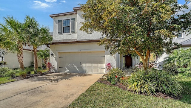 5548 Summit Gln, Bradenton, FL 34203 - view of front facade featuring stucco siding, an attached garage, and concrete driveway
