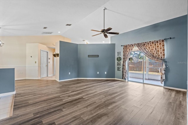 unfurnished living room with ceiling fan, lofted ceiling, and hardwood / wood-style flooring