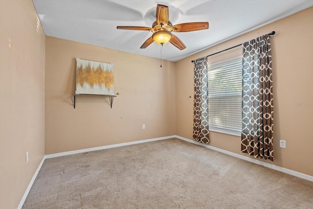 empty room with carpet flooring and ceiling fan