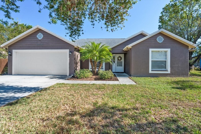 ranch-style home with a front lawn and a garage