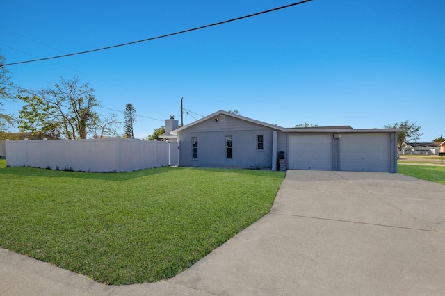 single story home with a front yard and a garage