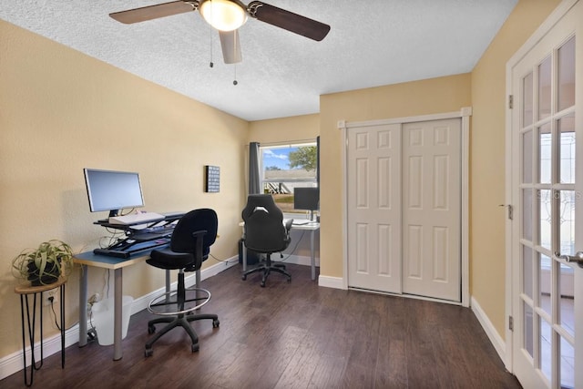 home office featuring ceiling fan, dark wood-type flooring, and a textured ceiling