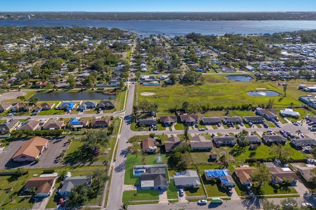 drone / aerial view with a water view