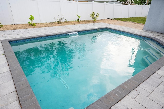 view of pool with pool water feature