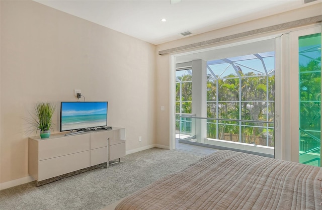 carpeted bedroom featuring access to exterior