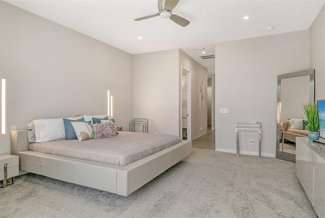 bedroom featuring ceiling fan and light carpet