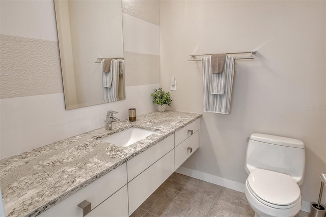 bathroom with vanity, a textured ceiling, and toilet