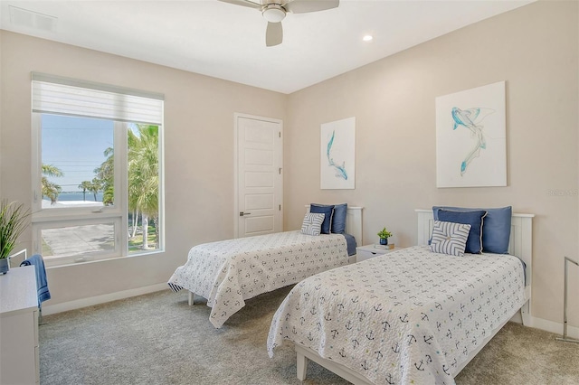 carpeted bedroom featuring ceiling fan