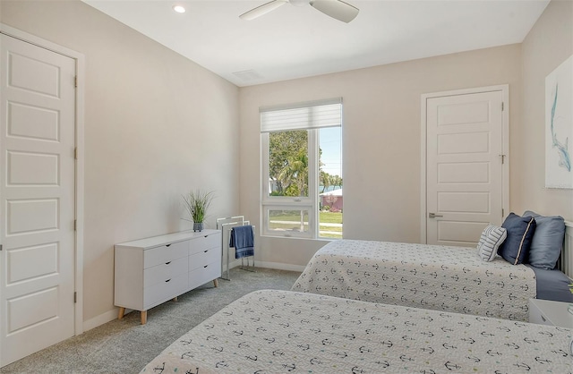 carpeted bedroom featuring ceiling fan