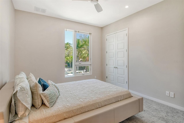 bedroom with carpet flooring, a closet, and ceiling fan