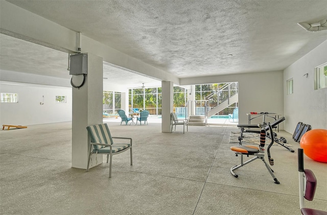 view of patio with glass enclosure and a swimming pool