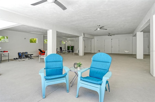 sitting room featuring a textured ceiling