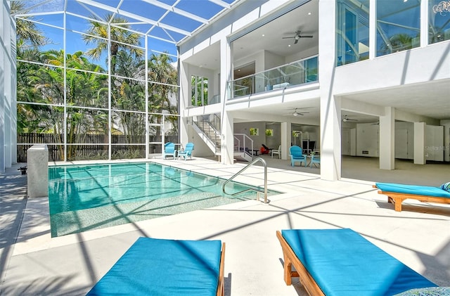 view of swimming pool featuring a patio and ceiling fan