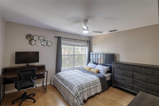 bedroom with ceiling fan and light hardwood / wood-style flooring