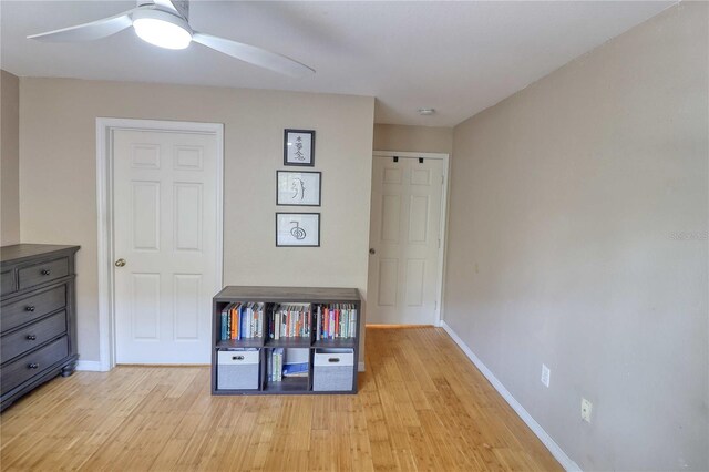 interior space with ceiling fan and light hardwood / wood-style floors