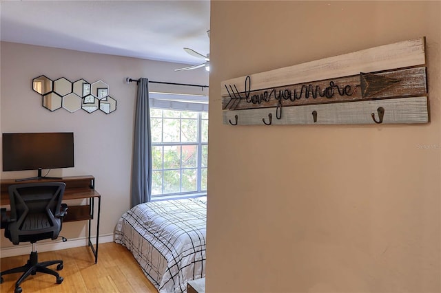 bedroom featuring ceiling fan and light hardwood / wood-style floors