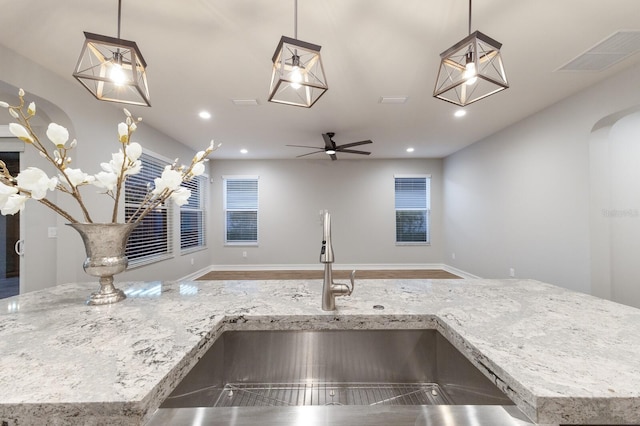 kitchen with hanging light fixtures and open floor plan