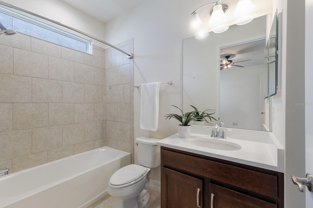 full bathroom featuring toilet, ceiling fan, vanity, and shower / bathtub combination