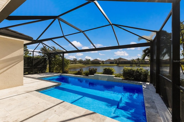 outdoor pool featuring a patio area, a water view, and a lanai