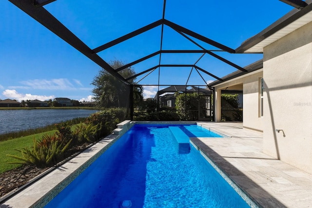 view of swimming pool featuring a water view, glass enclosure, and a patio area