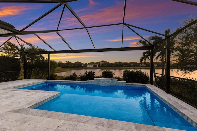 pool featuring a patio area, a water view, and a lanai