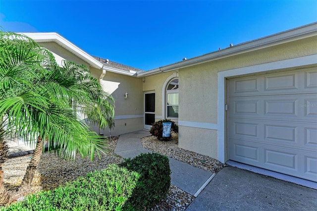 view of exterior entry featuring a garage